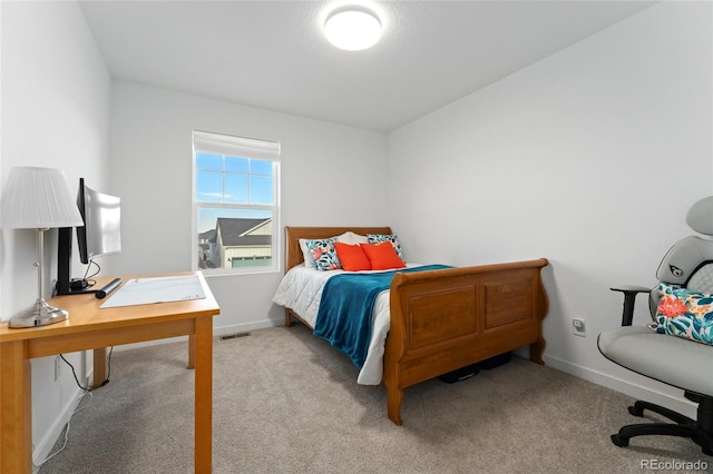 bedroom with carpet flooring, visible vents, and baseboards