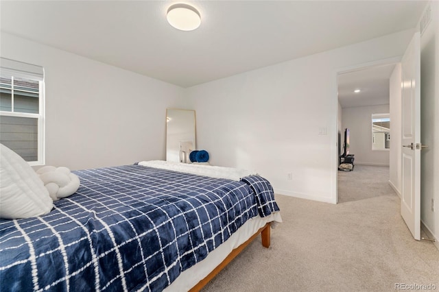 carpeted bedroom featuring visible vents and baseboards