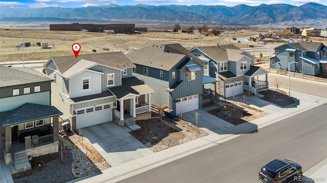 aerial view featuring a residential view and a mountain view