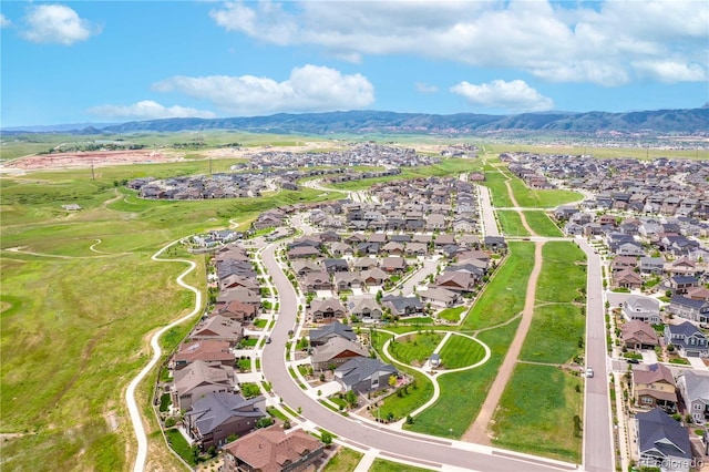 birds eye view of property featuring a mountain view and a residential view