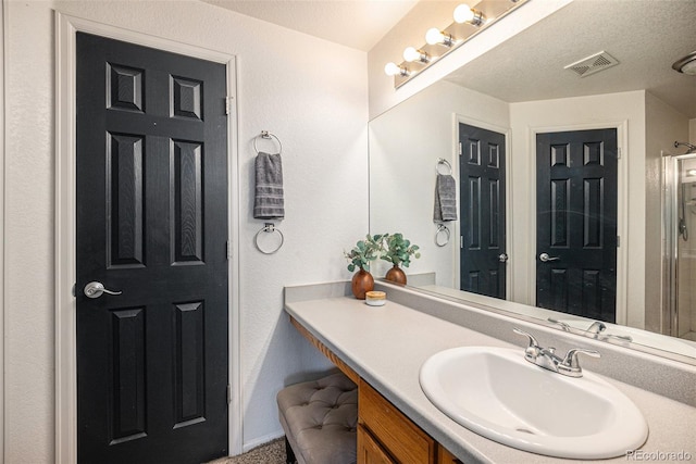 bathroom featuring visible vents and vanity