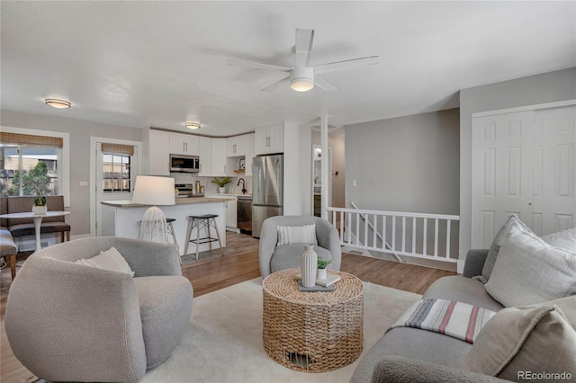 9400 Ridge Rd, Arvada, CO 80002 - living area with light wood-type flooring and a ceiling fan
