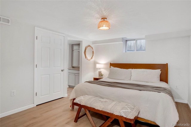 9400 Ridge Rd, Arvada, CO 80002 - bedroom with light wood-type flooring and baseboards