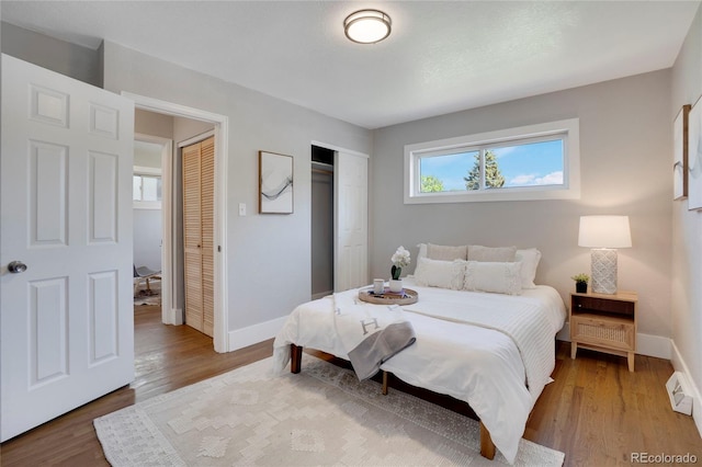 9400 Ridge Rd, Arvada, CO 80002 - bedroom with wood finished floors and a closet