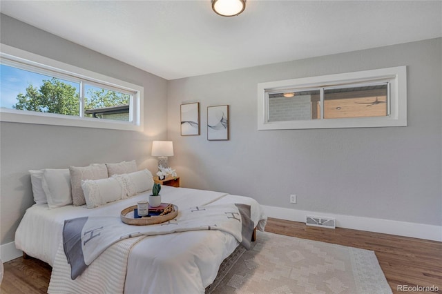 9400 Ridge Rd, Arvada, CO 80002 - bedroom with baseboards and wood finished floors