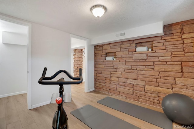 9400 Ridge Rd, Arvada, CO 80002 - exercise room featuring a textured ceiling and wood finished floors
