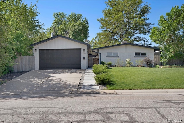 9400 Ridge Rd, Arvada, CO 80002 - ranch-style home with concrete driveway and a garage