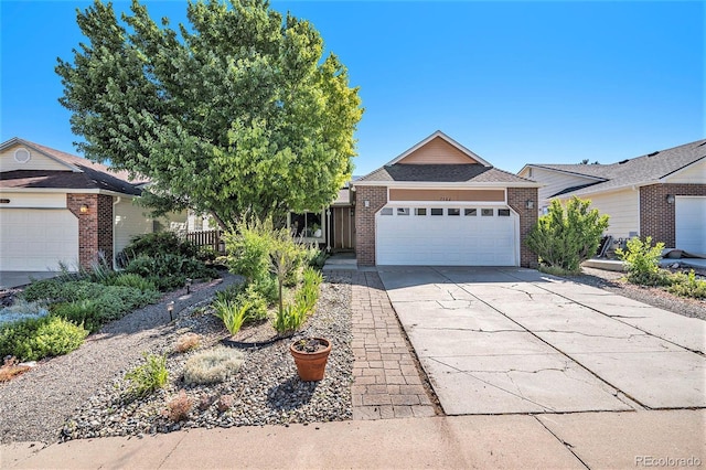 7582 Jared Way, Littleton, CO 80125 - ranch-style house with brick siding, concrete driveway, and an attached garage