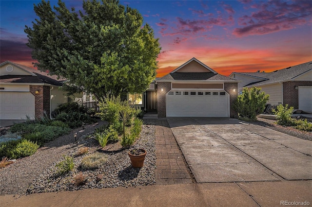 7582 Jared Way, Littleton, CO 80125 - ranch-style house featuring brick siding, an attached garage, and concrete driveway