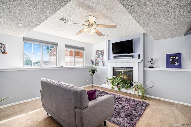 7582 Jared Way, Littleton, CO 80125 - carpeted living room featuring plenty of natural light, a textured ceiling, a ceiling fan, and a brick fireplace
