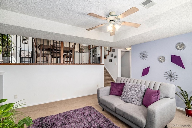7582 Jared Way, Littleton, CO 80125 - carpeted living area featuring ceiling fan, a textured ceiling, and stairs