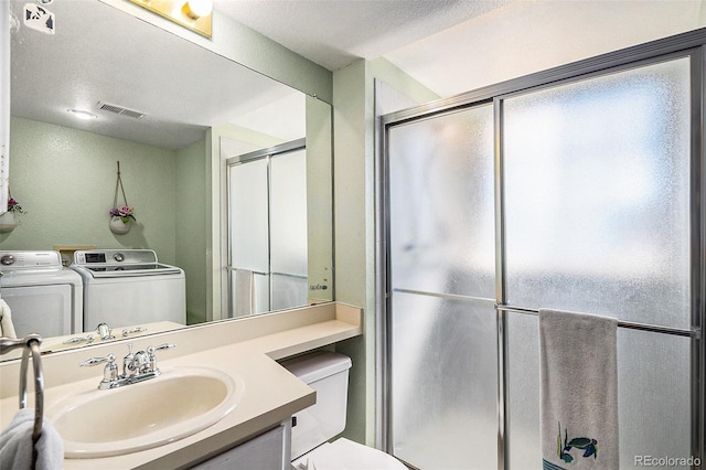 7582 Jared Way, Littleton, CO 80125 - full bath with a shower stall, vanity, and washer and clothes dryer