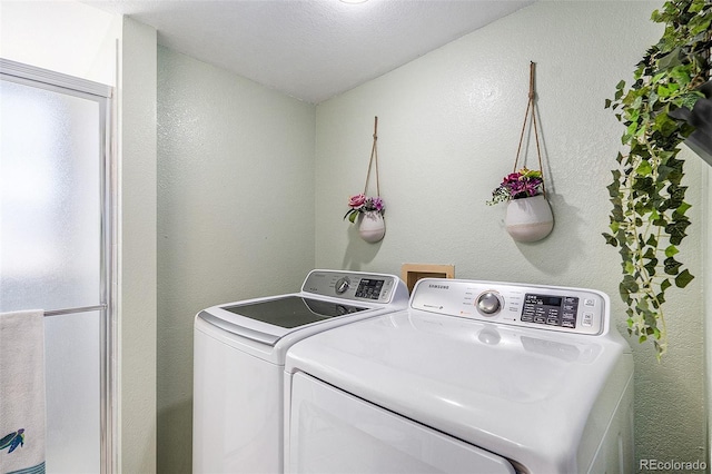 7582 Jared Way, Littleton, CO 80125 - laundry area featuring independent washer and dryer and a textured wall