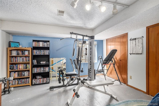 7582 Jared Way, Littleton, CO 80125 - workout room featuring a textured ceiling