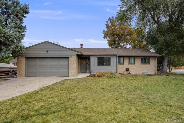 ranch-style home featuring brick siding, an attached garage, driveway, and a front lawn