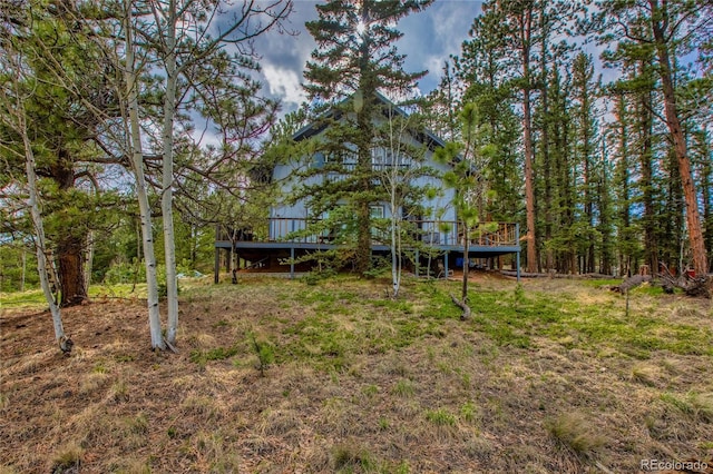 view of yard featuring a wooden deck