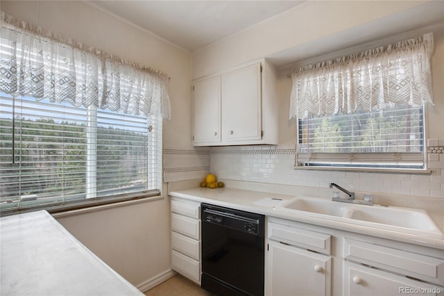 kitchen with sink, light tile patterned floors, black dishwasher, tasteful backsplash, and white cabinetry