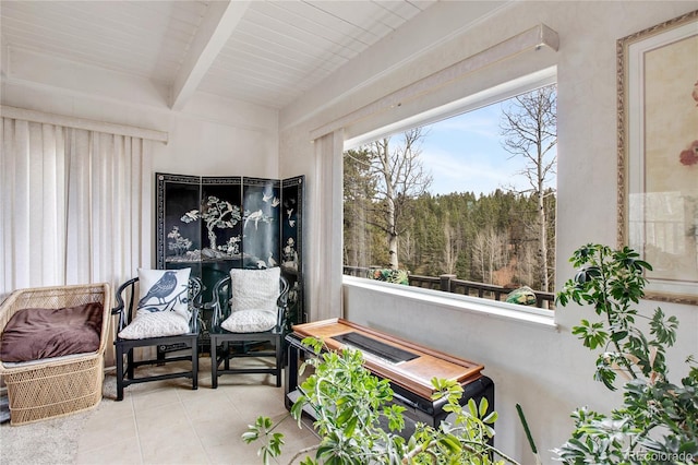 sunroom with beamed ceiling