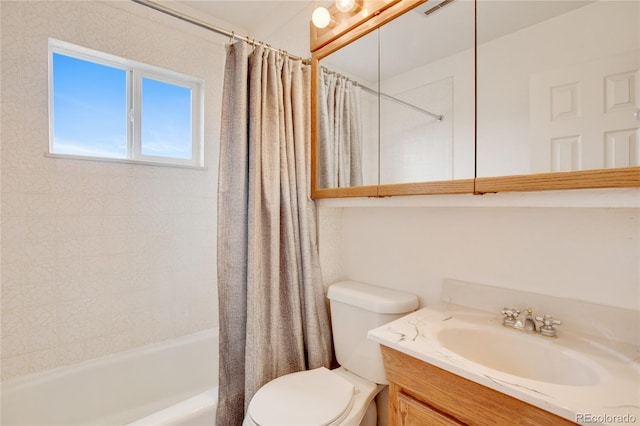 full bathroom featuring vanity, toilet, and shower / tub combo with curtain