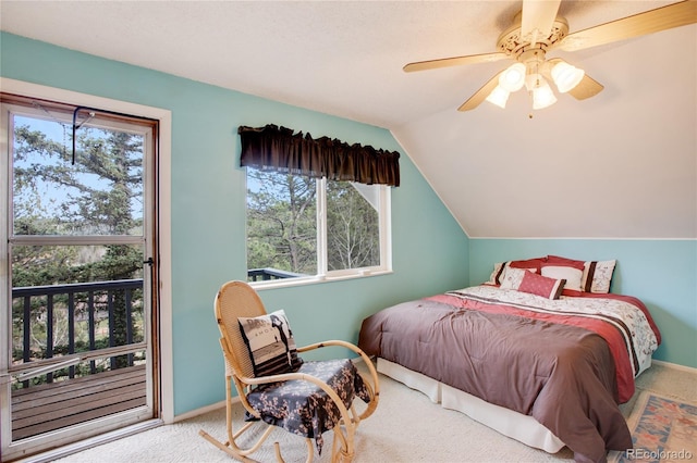 carpeted bedroom with vaulted ceiling and ceiling fan