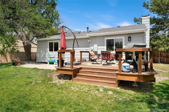 9376 W Wagon Trail Cir, Littleton, CO 80123 - rear view of property featuring a wooden deck, a chimney, and a shingled roof