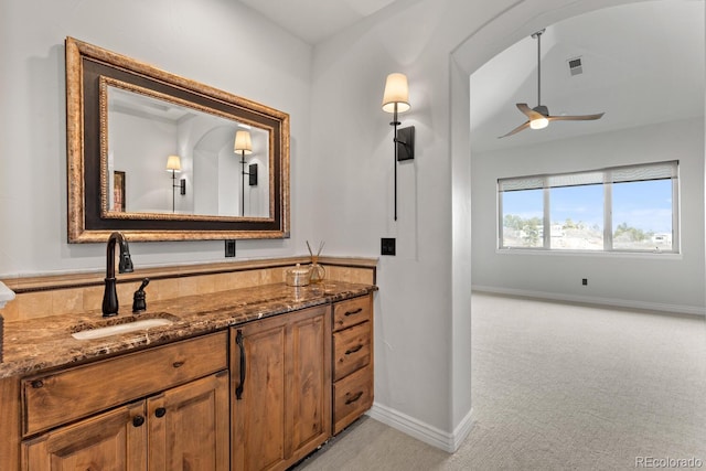 bathroom featuring vanity and ceiling fan