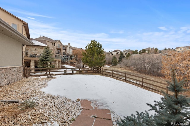 view of yard covered in snow