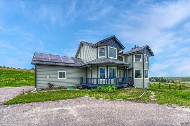 43793 Buckskin Rd, Parker, CO 80138 - victorian home featuring a porch, roof mounted solar panels, and roof with shingles