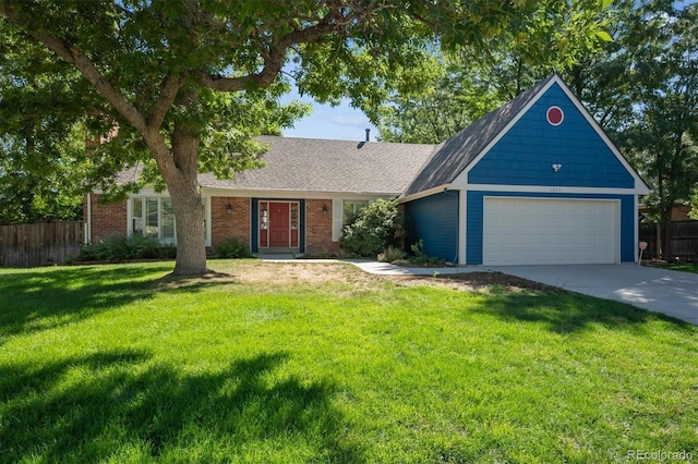 view of front facade featuring a front yard and a garage