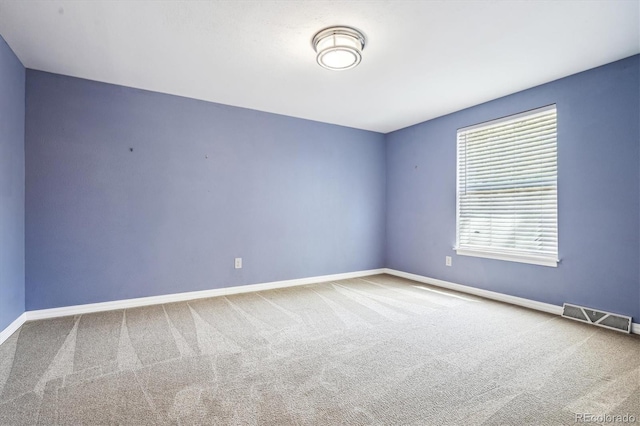 unfurnished room with carpet floors