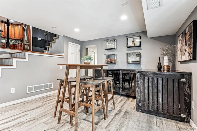 dining area with light hardwood / wood-style floors