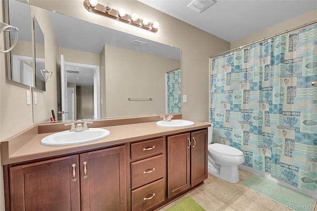 full bathroom with shower / tub combo with curtain, vanity, and toilet