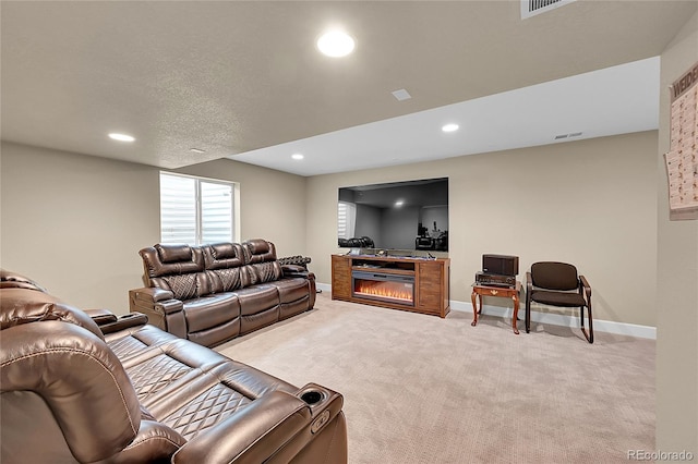 carpeted living room featuring a textured ceiling