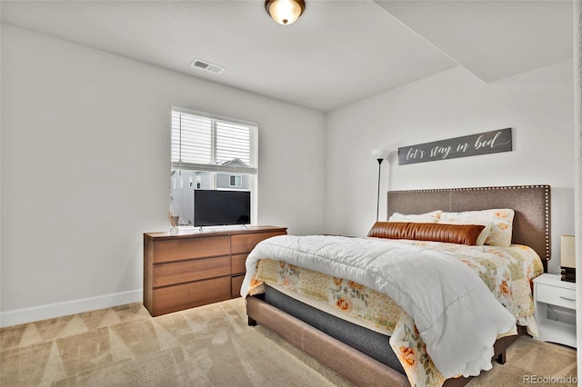 bedroom with light colored carpet