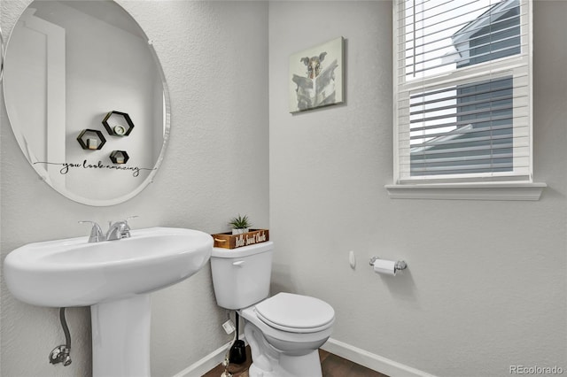 bathroom with toilet and sink