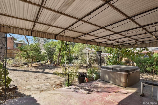 view of patio / terrace with a hot tub