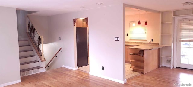 interior space with hardwood / wood-style floors