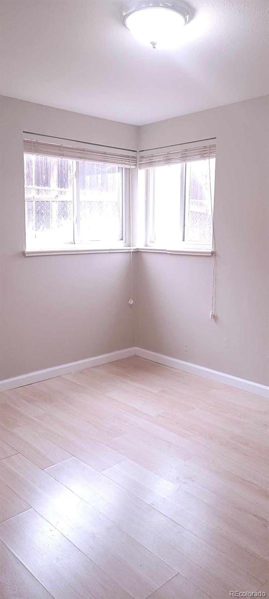 unfurnished room featuring light hardwood / wood-style flooring