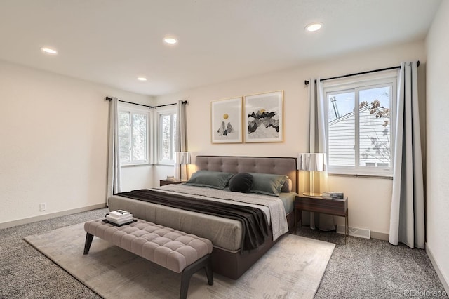 carpeted bedroom featuring multiple windows, baseboards, and recessed lighting