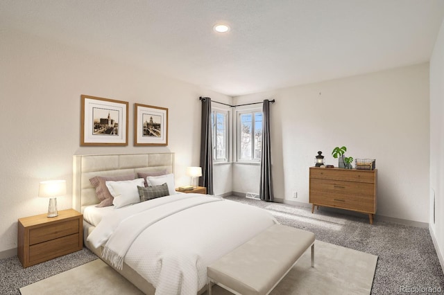 bedroom featuring carpet floors and baseboards