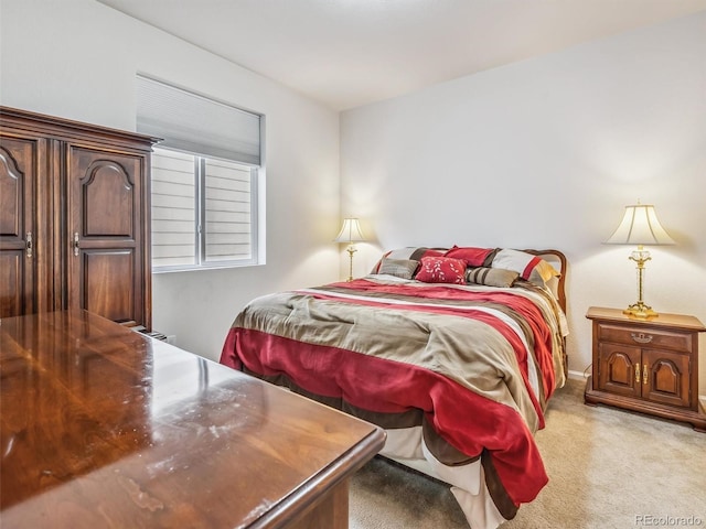 bedroom featuring light carpet