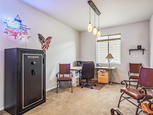 home office featuring light colored carpet and baseboards