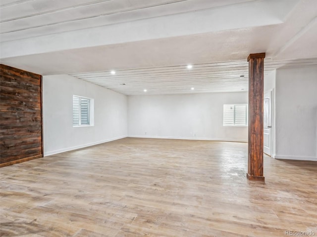 below grade area featuring light wood-style floors, baseboards, and recessed lighting