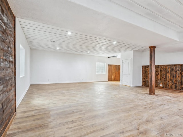 below grade area with recessed lighting, baseboards, and light wood finished floors