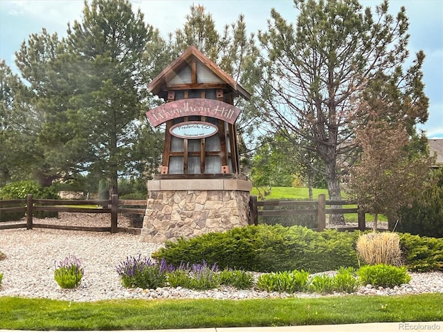 community sign featuring fence