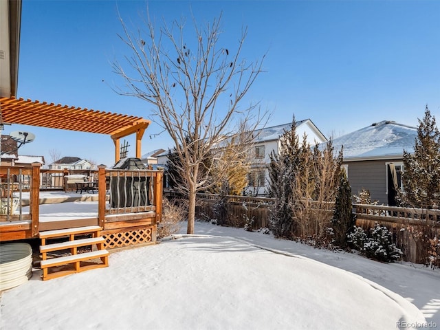 exterior space featuring a deck, fence, and a pergola