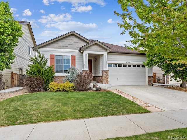 6308 Walnut Grove Way, Erie, CO 80516 - view of front facade with stone siding, a garage, fence, concrete driveway, and a front yard