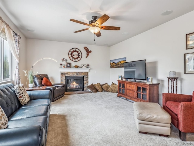 6308 Walnut Grove Way, Erie, CO 80516 - living room with a stone fireplace, carpet, and ceiling fan