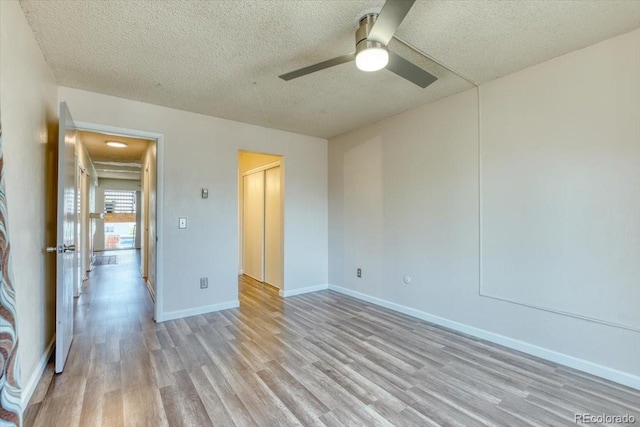 6007 Yarrow St Unit D, Arvada, CO 80004 - empty room featuring light wood-style floors, ceiling fan, and a textured ceiling