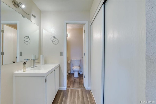 6007 Yarrow St Unit D, Arvada, CO 80004 - bathroom featuring wood finished floors and vanity
